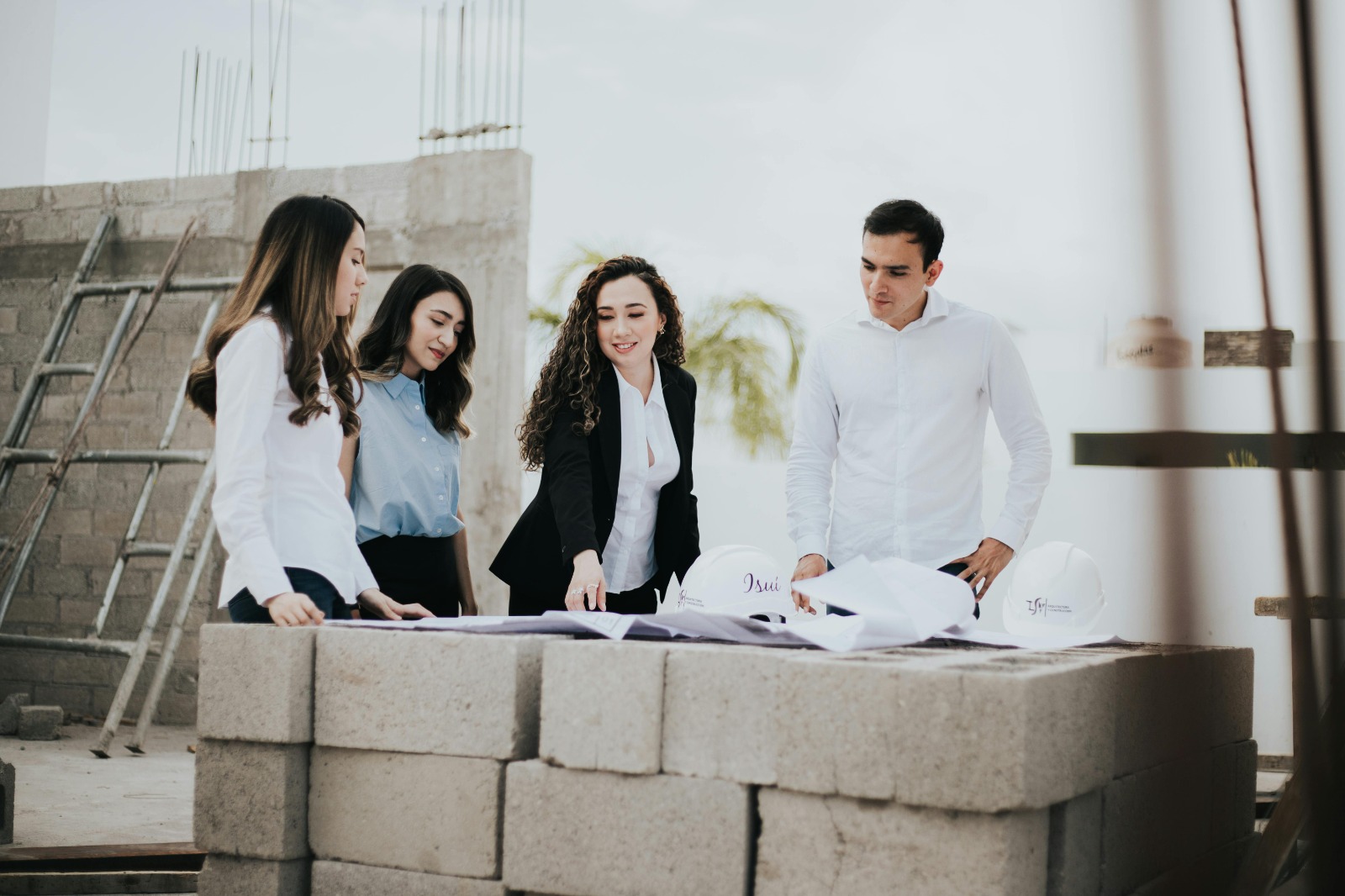 Quantity surveyors and cost engineers analyzing project estimates and budgets